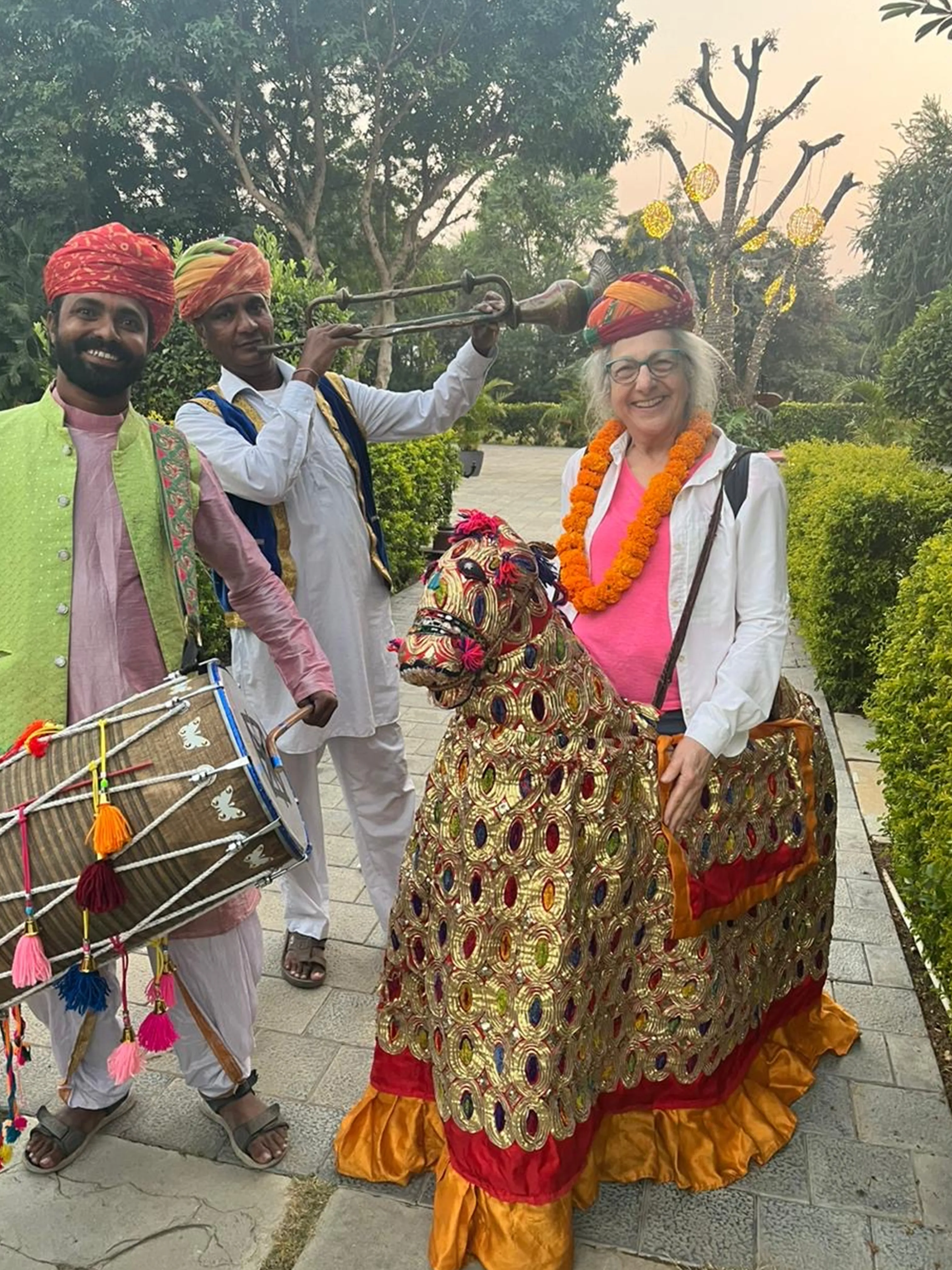 Person with marigold garland