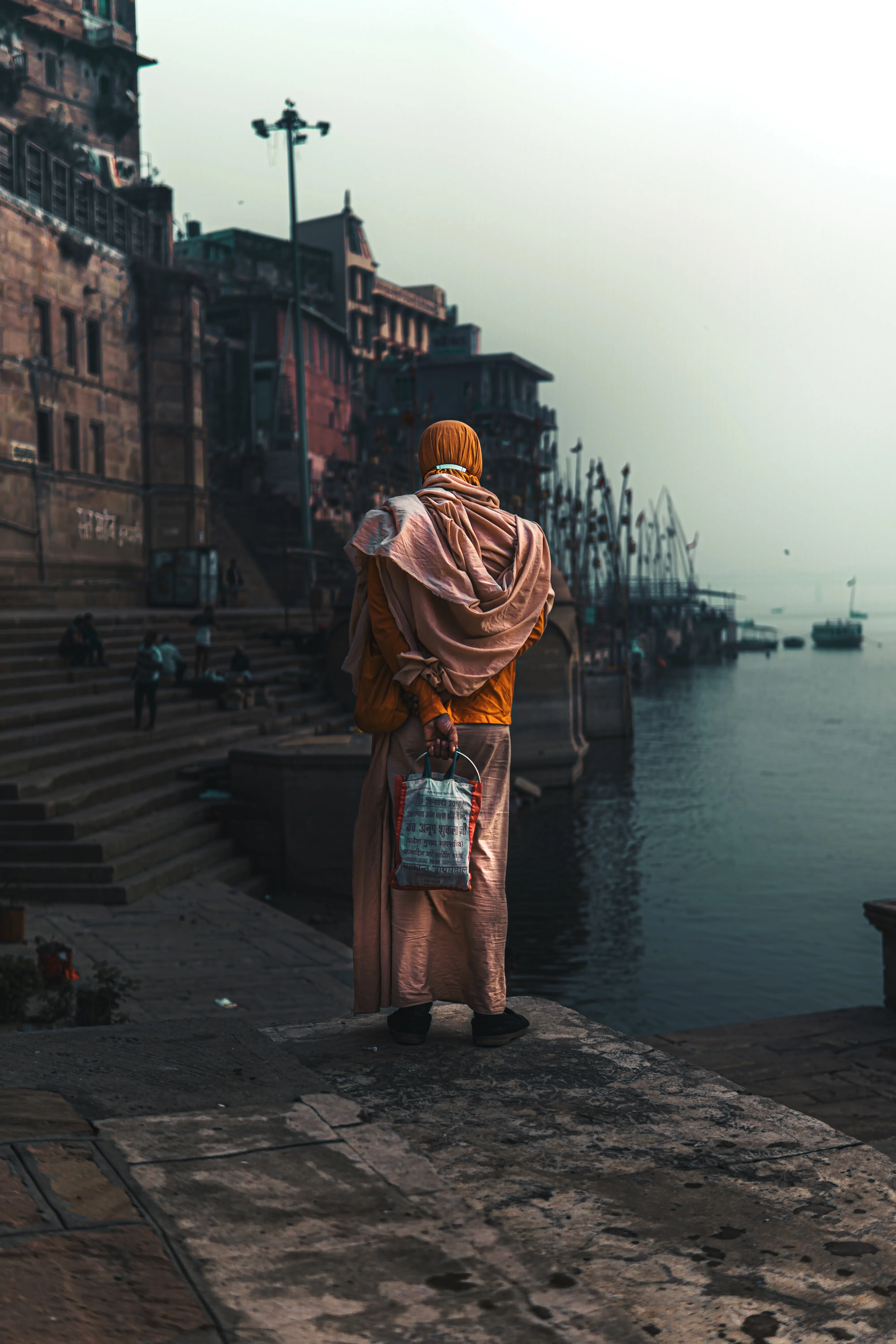A sadhu in traditional saffron attire at the ghats of Varanasi