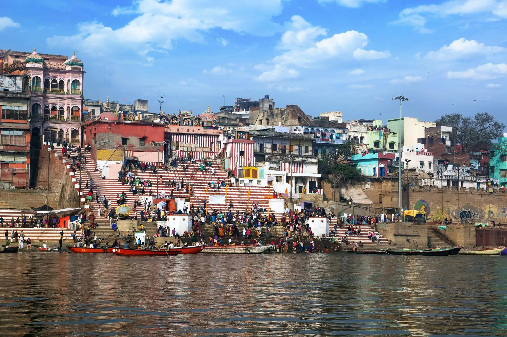 Colorful ghats and historic architecture along the Ganga in Varanasi